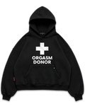 Los Surenos Orgasm Donor siyah hoodie ön görünüm, oversize boxy fit kapüşonlu sweatshirt, minimal tipografi ve artı sembol baskılı cesur streetwear tasarım #siyah